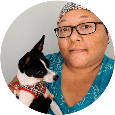 Angela holding a smaill boarding dog